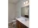 Bright bathroom featuring a vanity with a sink, mirror, and a toilet for convenience at 42 Hemming Ct, Cameron, NC 28326