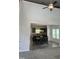 Open dining area featuring hardwood floors, modern lighting, and an adjacent open kitchen space at 42 Hemming Ct, Cameron, NC 28326
