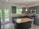 Kitchen featuring stainless appliances, granite countertops, tile backsplash, and access to backyard deck at 42 Hemming Ct, Cameron, NC 28326