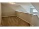 Carpeted loft area with natural light and neutral walls at 42 Hemming Ct, Cameron, NC 28326