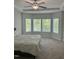 Spacious bedroom featuring a tray ceiling, carpet floors, and plenty of natural light at 42 Hemming Ct, Cameron, NC 28326