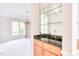Built-in bar area with upper shelves, lower cabinets, and granite countertop next to dining room at 4404 Triland Way, Cary, NC 27518