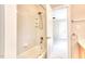 Bright bathroom with a shower-tub combo and tile surround at 4404 Triland Way, Cary, NC 27518