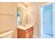 Bathroom vanity with a sink, mirror, and door that leads to another room at 4404 Triland Way, Cary, NC 27518