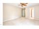 A cozy bedroom with neutral colors, ceiling fan, and ample natural light at 4404 Triland Way, Cary, NC 27518