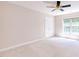 Bright bedroom with a ceiling fan, large window and closet at 4404 Triland Way, Cary, NC 27518
