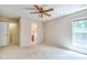 Bedroom with a ceiling fan, natural light from the window, and an ensuite bathroom at 4404 Triland Way, Cary, NC 27518