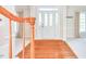 Inviting foyer with hardwood floors and a view of the front door with sidelights at 4404 Triland Way, Cary, NC 27518