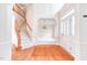 Welcoming foyer with hardwood floors and stairs leading to a second floor at 4404 Triland Way, Cary, NC 27518