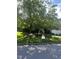 A charming home with a lush, green lawn and mature trees in a tranquil residential neighborhood at 4404 Triland Way, Cary, NC 27518