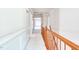 Upstairs hallway with fresh paint and wainscotting along the walls at 4404 Triland Way, Cary, NC 27518