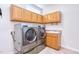 Spacious laundry room with lots of cabinet space and stainless steel washer and dryer at 4404 Triland Way, Cary, NC 27518