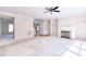 Spacious living room boasts fireplace, and adjacent hardwood hallway leading to staircase at 4404 Triland Way, Cary, NC 27518