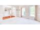 Bright living room showcasing neutral carpet, natural light and an archway leading to other rooms at 4404 Triland Way, Cary, NC 27518