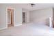 Carpeted loft space with neutral walls, multiple doorways and natural light at 4404 Triland Way, Cary, NC 27518