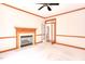 Bright office featuring a fireplace, crown molding, ceiling fan and an open doorway at 4404 Triland Way, Cary, NC 27518