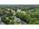 Aerial shot of a golf community featuring tree-lined streets and lush landscaping at 4705 Forest Highland Dr, Raleigh, NC 27604