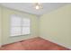 Bedroom featuring neutral paint, a ceiling fan, and window with blinds for natural light at 4705 Forest Highland Dr, Raleigh, NC 27604