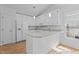 Kitchen featuring white cabinets, granite countertops, and stainless steel appliances at 4705 Forest Highland Dr, Raleigh, NC 27604
