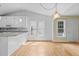 Eat-in kitchen with pendant lights, stainless steel appliances, and bright natural light at 4705 Forest Highland Dr, Raleigh, NC 27604