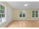 Bright interior showcases large windows that fill the space with natural light at 4705 Forest Highland Dr, Raleigh, NC 27604