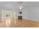Open living room featuring fireplace and ceiling fan at 4705 Forest Highland Dr, Raleigh, NC 27604
