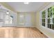 Bright living room featuring ample natural light streaming through large windows at 4705 Forest Highland Dr, Raleigh, NC 27604