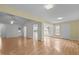 Bright, open living room with hardwood floors, neutral paint, and great natural light at 4705 Forest Highland Dr, Raleigh, NC 27604