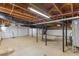 Unfinished basement with exposed beams and utilities provides ample storage and potential for customization at 4713 Erwin Rd, Durham, NC 27705