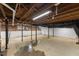 Spacious unfinished basement with exposed utilities, brick, and room to customize at 4713 Erwin Rd, Durham, NC 27705