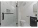 Modern bathroom featuring a tiled shower with glass door, vanity, and commode at 4713 Erwin Rd, Durham, NC 27705