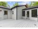 An expansive white deck with access to doors provides ample space for outdoor enjoyment at 4713 Erwin Rd, Durham, NC 27705
