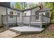 A spacious gray deck with stairs, perfect for outdoor entertaining or relaxation at 4713 Erwin Rd, Durham, NC 27705