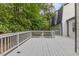 This gray deck is the perfect spot for outdoor gatherings and relaxation with plenty of space at 4713 Erwin Rd, Durham, NC 27705