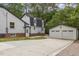 Rear exterior view showing the garage and access to the home at 4713 Erwin Rd, Durham, NC 27705