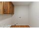 This laundry room space features clean, white walls, wood flooring, and plenty of space at 4713 Erwin Rd, Durham, NC 27705