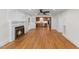Bright living room featuring a fireplace and view of the kitchen, perfect for modern living at 4713 Erwin Rd, Durham, NC 27705
