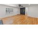 Open-concept living room features natural light and hardwood floors throughout the space at 4713 Erwin Rd, Durham, NC 27705