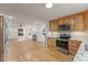 Open layout with a kitchen flowing into a living room with fireplace and abundant natural light at 4713 Erwin Rd, Durham, NC 27705