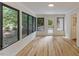 Sunroom with neutral walls and many windows with access to the backyard at 4713 Erwin Rd, Durham, NC 27705