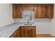 Well-lit wet bar featuring custom cabinetry and a stylish countertop at 4713 Erwin Rd, Durham, NC 27705