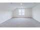 Bedroom featuring neutral carpet, recessed lighting, and a window offering ample natural light at 48 Sanders Farm Dr, Smithfield, NC 27577