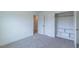 Bedroom featuring neutral carpet, a closet and white trim for a clean and modern look at 48 Sanders Farm Dr, Smithfield, NC 27577