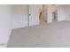 Bedroom featuring neutral carpet with access to the bathroom, walk-in closet and stairwell at 48 Sanders Farm Dr, Smithfield, NC 27577