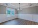 Dining room with wainscoting, coffered ceilings and large window at 48 Sanders Farm Dr, Smithfield, NC 27577