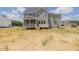 Exterior rear view of a two-story home with a screened porch and a spacious yard at 48 Sanders Farm Dr, Smithfield, NC 27577