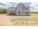 Charming two-story home features a welcoming entrance, attached two car garage, and classic architectural details at 48 Sanders Farm Dr, Smithfield, NC 27577