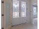 Bright foyer showcases glass paned double doors and a glimpse of the spacious interior and outdoor views at 48 Sanders Farm Dr, Smithfield, NC 27577