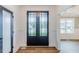 Bright foyer with hardwood floors and stylish front door at 48 Sanders Farm Dr, Smithfield, NC 27577