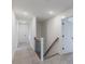 Upstairs hallway with carpet and white doors at 48 Sanders Farm Dr, Smithfield, NC 27577